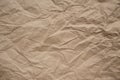 Brown rough crumpled recycled paper texture