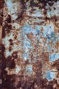 Brown rust, scratched peeled off blue paint. Door made rusty shabby sheet metal. Textured rough metal surface, rusty metal Royalty Free Stock Photo