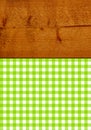 Brown rustic wooden texture with green white tablecloth Royalty Free Stock Photo