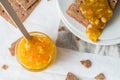 Brown rye crisp bread Swedish crackers with spread orange jam Royalty Free Stock Photo