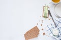 Brown rye crispy bread Swedish crackers with spread cottage cheese with plates and tea cup