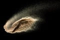 Brown sand explosion isolated on black background. Freeze motion of sandy dust splash.Sand texture concept Royalty Free Stock Photo