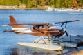 Brown Seaplane Moored to a Jetty at Sunset Royalty Free Stock Photo