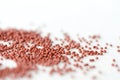 Brown seed beads on textile background close up Royalty Free Stock Photo