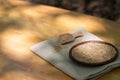 Brown sesame seeds in a clay bowl on a wooden table. Royalty Free Stock Photo