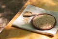 Brown sesame seeds in a clay bowl on a wooden table. Royalty Free Stock Photo