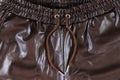 Brown faux leather elasticated waist drawstring jogger trousers close-up