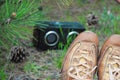 Brown shoe of hipster girl lying on the grass and listening music