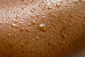 Brown skin with sweat droplets