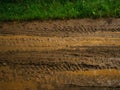 Brown slush and mud on the road. Traces of trucks Royalty Free Stock Photo