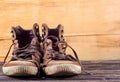 Brown sneakers on wood desk