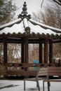 Brown snow covered pavilion near bench in Pyeongtaek-si Royalty Free Stock Photo