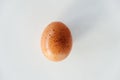 Brown speckled chicken egg on white background Royalty Free Stock Photo