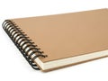 Brown spiral notebook on white background Royalty Free Stock Photo