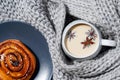 Top view of a cup of a milk tea with star anise and cinnamon bun Royalty Free Stock Photo