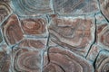 Brown stone background texture, free space. Stone tile floor paving fragment. Stone wall surface with cement.