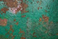 Brown stone painted with paint in pink and green. Rock background, texture. Pattern Royalty Free Stock Photo