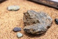 The brown stone on Yellow Sand closeup