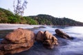 Brown stones on tropical sand beach at dusk Royalty Free Stock Photo