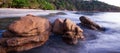 Brown stones on tropical sand beach at dusk Royalty Free Stock Photo