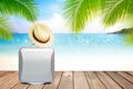 Brown straw hat and suitcase on wooden table with blurred sea,blue sky and palm tree background with copy space. Royalty Free Stock Photo