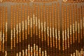 Brown striped wooden texture from a curtain of small beads Royalty Free Stock Photo