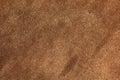Brown suede closeup background. The texture of soft natural suede of the highest quality