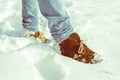 Brown suede Desert Boots covered in snow