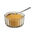 Brown sugar in bowl with spoon, isolated Royalty Free Stock Photo