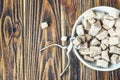 Brown sugar cane and tongs on wooden background. Royalty Free Stock Photo