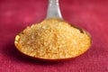 Brown sugar crystals on spoon