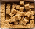 Brown sugar cubes in the paper package. Top view Royalty Free Stock Photo