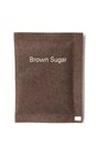 Brown sugar packet Royalty Free Stock Photo