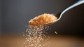 Brown Sugar Pouring from Spoon Close Up Royalty Free Stock Photo