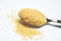 Brown sugar in a spoon on white background Royalty Free Stock Photo