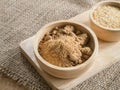 Brown sugar and wheat germ in wooden bowl Royalty Free Stock Photo