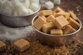 Brown sugar and white sugar in bowl on wooden table Royalty Free Stock Photo