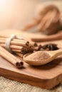 Brown sugar on wood spoon and cinnamon sticks Royalty Free Stock Photo