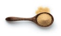 Brown sugar in wood spoon on white background. Top view Royalty Free Stock Photo