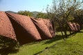 Brown tableclothes left to dry moved by the wind on a clear summer day Royalty Free Stock Photo