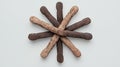 Brown and Tan Breadsticks Starburst Pattern on Light Gray Background Royalty Free Stock Photo