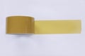 Brown tape pasted to the white background.Adhesive tape for, repair work, packaging, construction etc Royalty Free Stock Photo