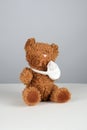 brown teddy bear with a bandaged paw Royalty Free Stock Photo