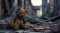 Brown Teddy Bear Sitting on Pile of Rubble