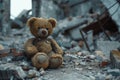 Brown Teddy Bear Sitting on Pile of Rubble Royalty Free Stock Photo