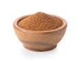 Brown teff grain in wood bowl on white background