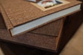 Brown textile wedding photo book or album.