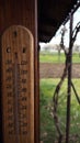 Brown thermometer in the garden Royalty Free Stock Photo