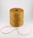 Brown thread roll isolated on white background