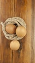 Brown three egg in a nest of twine for Happy Easter Royalty Free Stock Photo